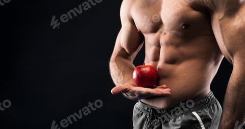 Preview: Unrecognizable man holding red apple in his muscular hand