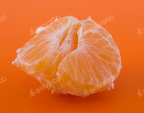 Preview: Peeled tangerine segments isolated on orange background