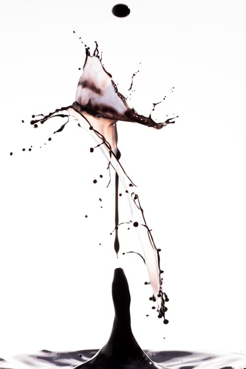 Preview: Splash of brown color liquid with high speed flash