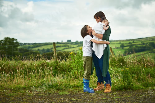 Preview: Shot of a mother and her two little kids bonding together outdoors