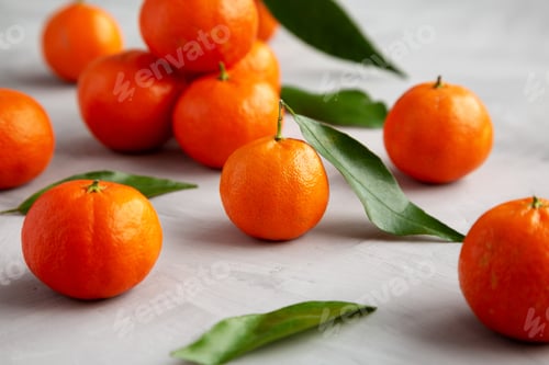 Preview: Raw Organic Mandarins on a gray background, side view. Close-up.