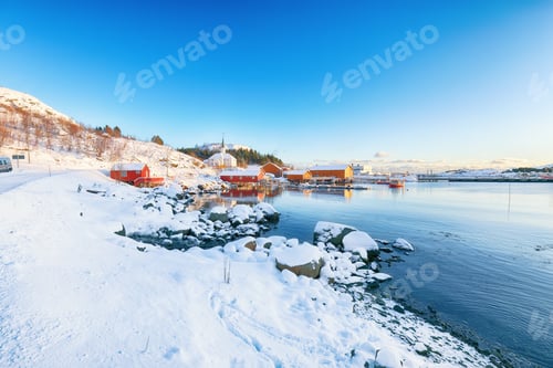 Preview: Stunning winter scenery of Moskenes village with ferryport and famous Moskenes parish Churc