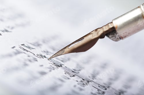 Preview: Close up of a fountain pen writing on bright white paper