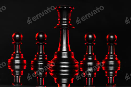 Preview: Chess pieces on dark background with red backlight close up