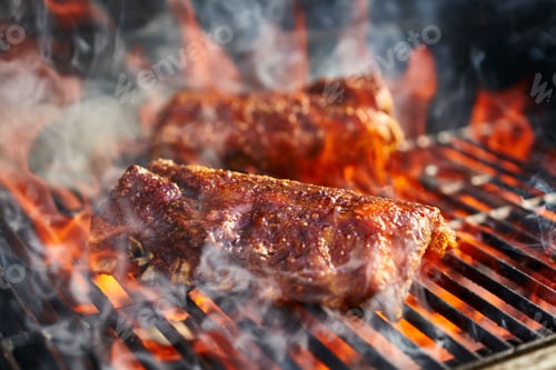 Preview: bbq pork ribs cooking on flaming grill