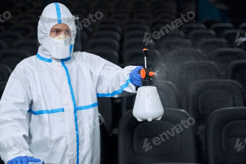 Preview: Man making disinfection in cinema.