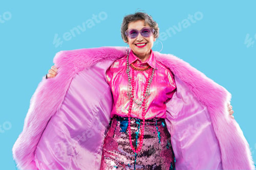 Preview: Happy and funny senior old woman on colorful background