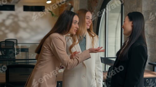 Preview: Three diverse business women friendly smiling laughing happy girls multiracial female multiethnic