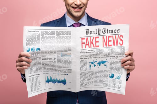 Preview: cropped view of businessman reading newspaper with fake news isolated on pink