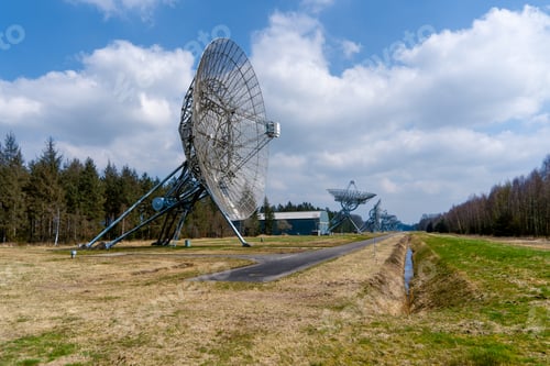 Preview: the two satellite dishes have been placed on the grass in a field