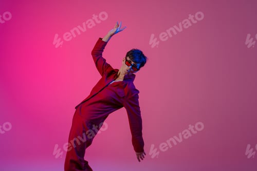 Preview: Mature european woman wearing sunglasses dancing on camera