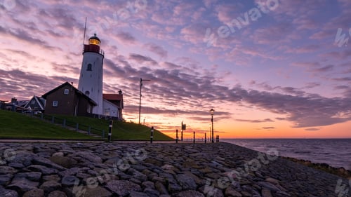 Preview: Urk Flevoland Netherlands sunset at the lighthouse and harbor of Urk Holland