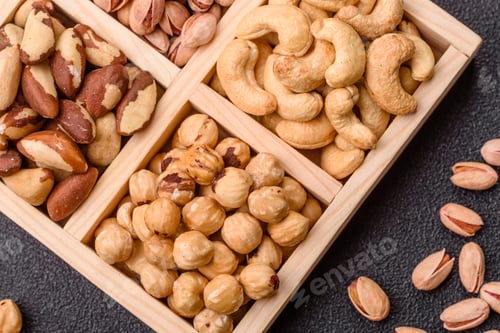 Preview: A box of cashews, hazelnuts, pistachios, and Brazil nuts as healthy food ingredients. A box of nuts