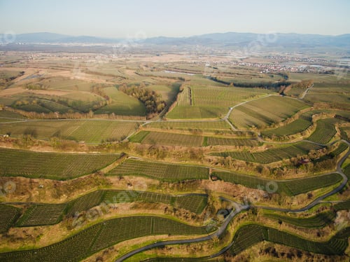 Preview: Aerial view of landscape with green fields on tiers, Germany