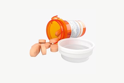 Preview: Open pill bottle with spilled contents and adjacent container