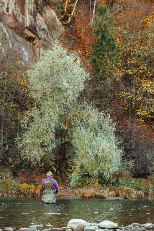 Preview: fishermen in autumn mountain river