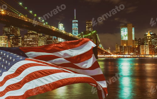 Preview: Close up of the Brooklyn bridge with U.S. flag at night, New York City, USA
