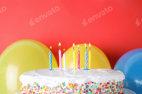 Preview: Tasty birthday cake with burning candles and balloons on red background, space for text