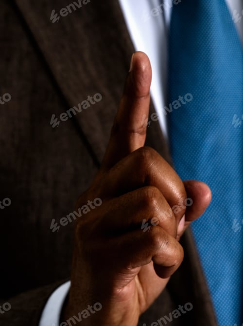 Preview: Business man holding one finger up