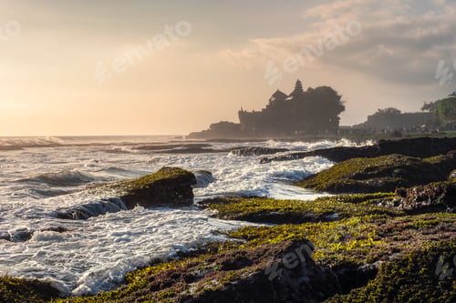 Preview: Ancient Tanah Lot temple on rocky mountain at coastline
