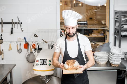 Preview: Baker with bread in the bakery