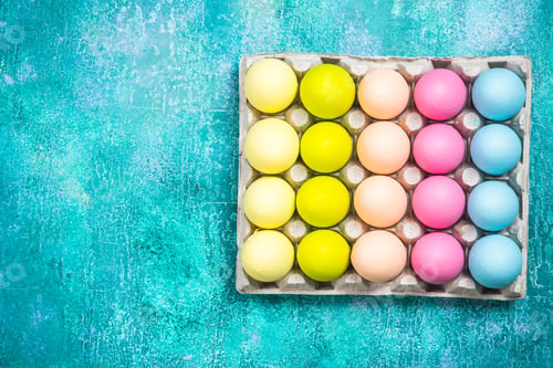 Preview: Colorful painted eggs for Easter on vibrant background. Flat lay