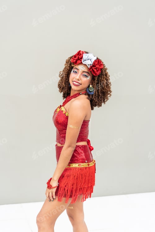 Preview: Woman posing in a red carnival costume with a festive smile