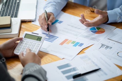 Preview: Business Analytics Team Reviewing Sales Charts Together