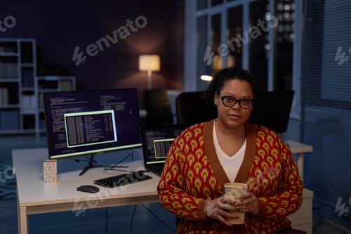 Preview: Female developer working in office till late night