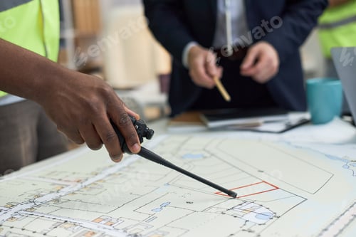 Preview: Middle Aged Black Man Supervising Construction Project Planning in Office
