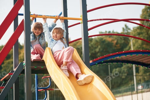 Preview: Children are active, smiling. Kids are having fun on the playground