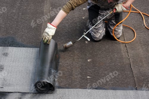 Preview: Worker doing roofers welding line with a gas torch
