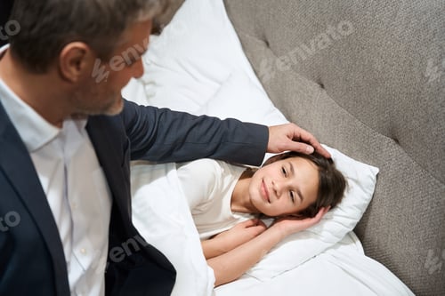 Preview: Father stroking smiling girl in the hotel