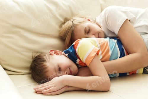 Preview: Mother and son sleeping on the sofa