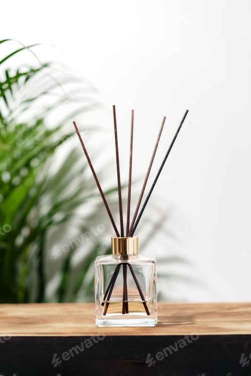 Preview: Glass Diffuser Bottle With Wooden Sticks on Wooden Tabletop