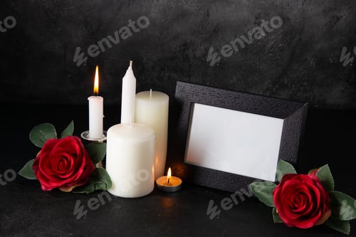 Preview: picture frame with burning candles and red flower on gray surface war tank death