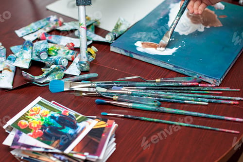 Preview: The Artist'S Hands Close-Up On The Background Of The Palette Of Oil Paints