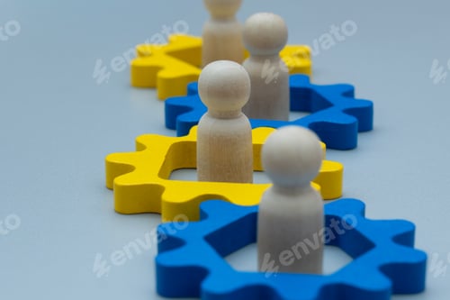 Preview: Wooden figures inside interconnected gears.