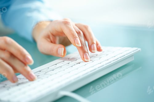 Preview: Woman office worker typing on the keyboard