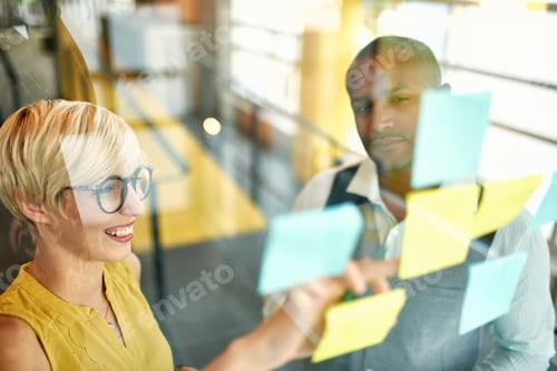 Preview: Two creative millenial small business owners working on social media strategy brainstorming