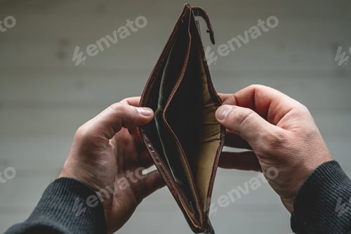 Preview: Empty wallet in the hands of a young man