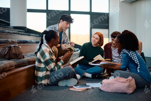 Preview: Young happy college friends studying together in lecture hall.