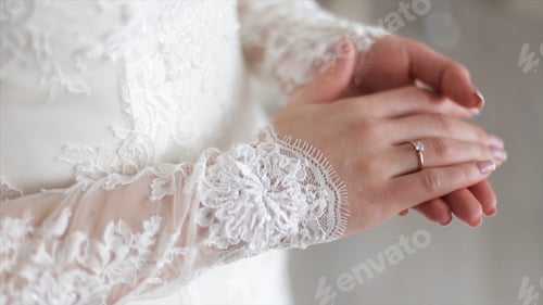 Preview: Close up of elegant ring on the finger. Soft and selective focus. Close-up of tender ring on bride's