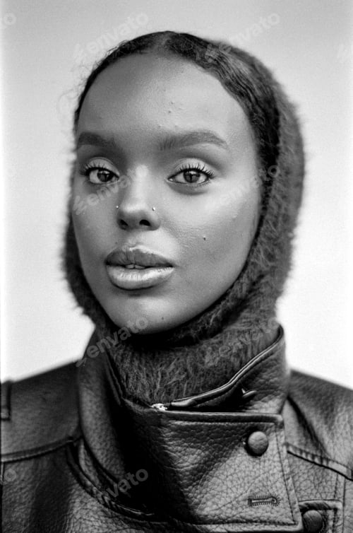 Preview: Young black woman wearing balaclava and leather jacket