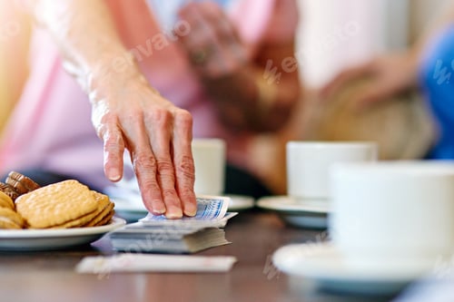 Preview: Taking one from the deck. Cropped shot of seniors playing cards in their retirement home.