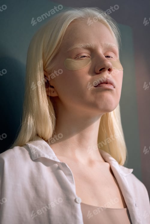 Preview: Woman with Collagen Patches Under Eyes Looking at Camera
