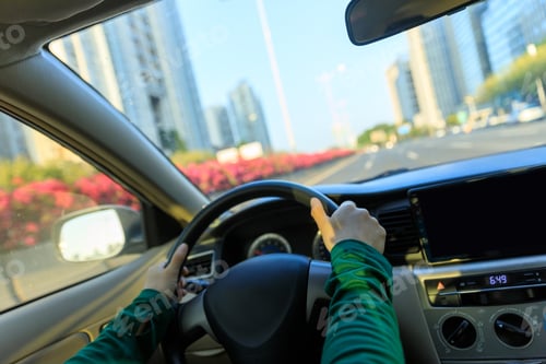 Preview: People driving car on city road