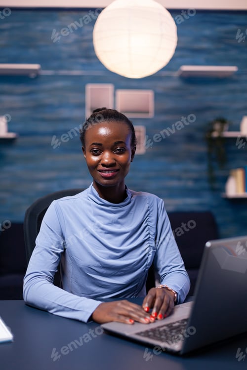 Preview: Overworked african entrepreneur sitting at office table