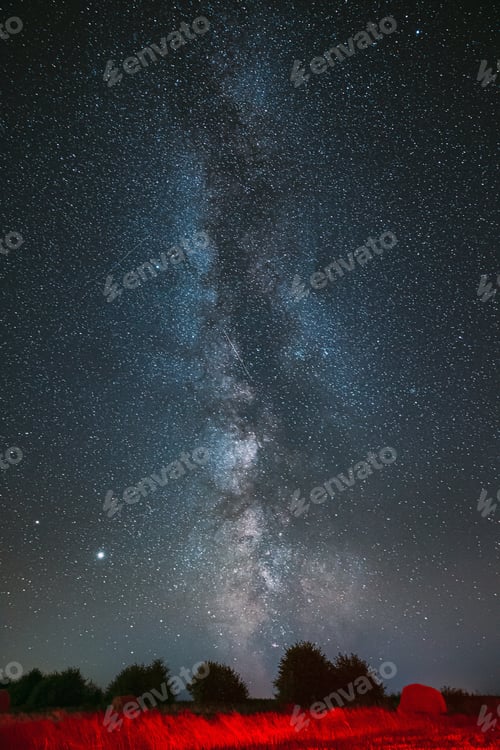 Preview: Milky Way Galaxy In Night Starry Sky Above Haystack In Summer Agricultural Field. Night Stars Above