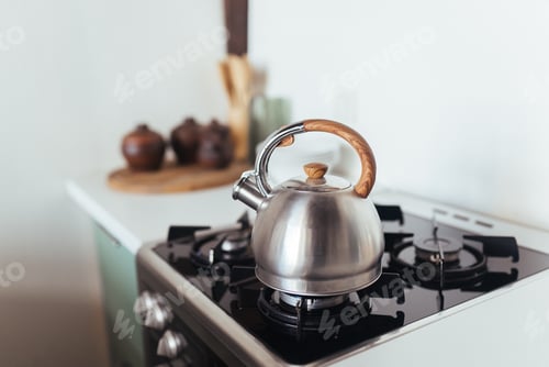 Preview: Kettle on the gas stove. Interior of modern kitchen
